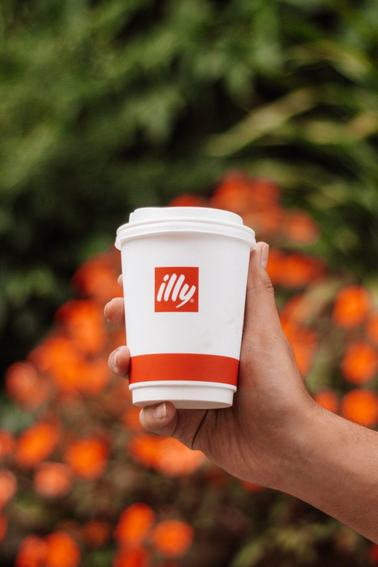 Man holding branded Coffee Cup